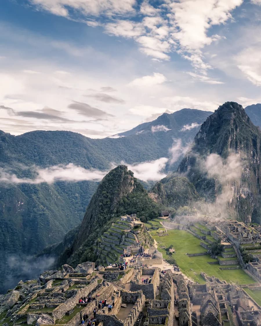 The terraces of Machu Picchu among mist-covered peaks in Peru