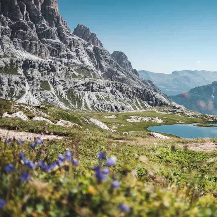 A lake below the limestone peaks of the Dolomites